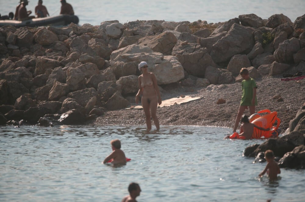 FKK cove pyramid in waters - Nudists relax beautifully—a sight to behold