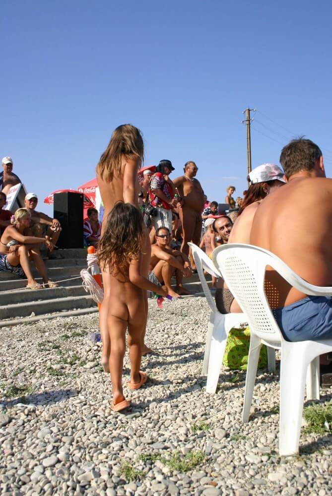 Naturist Standing Sideline - The practice of nudism helps us shed imposed stereotypes and insecurities