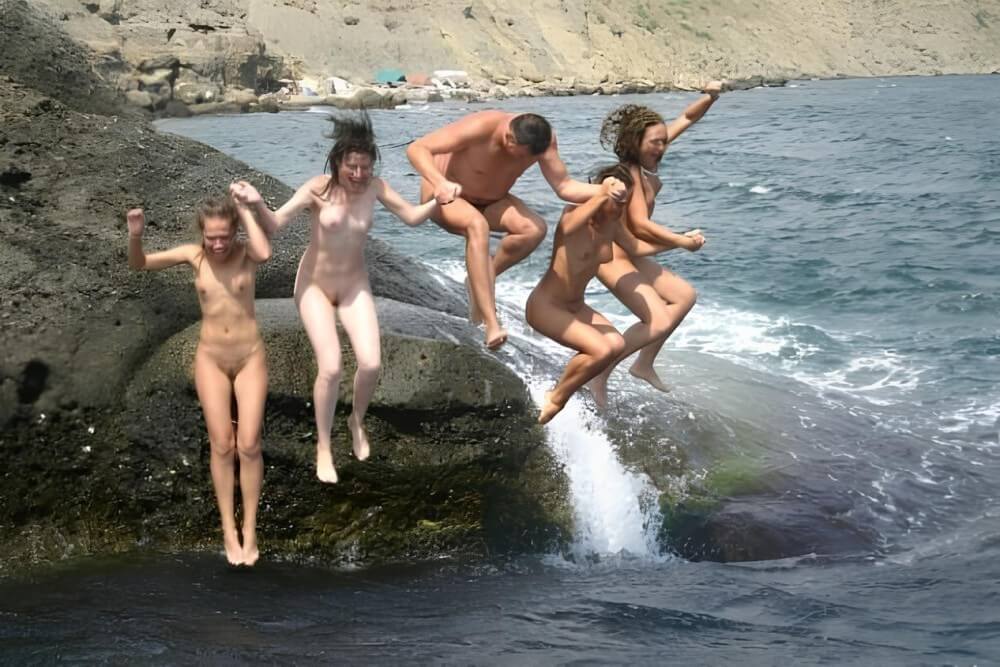Mens and girls nudists on a beach - Nudism brings joy and pleasure
