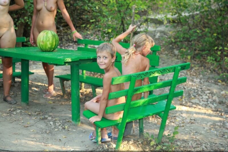 Naturists green picnic photos - Nudists relax beautifully—a sight to behold