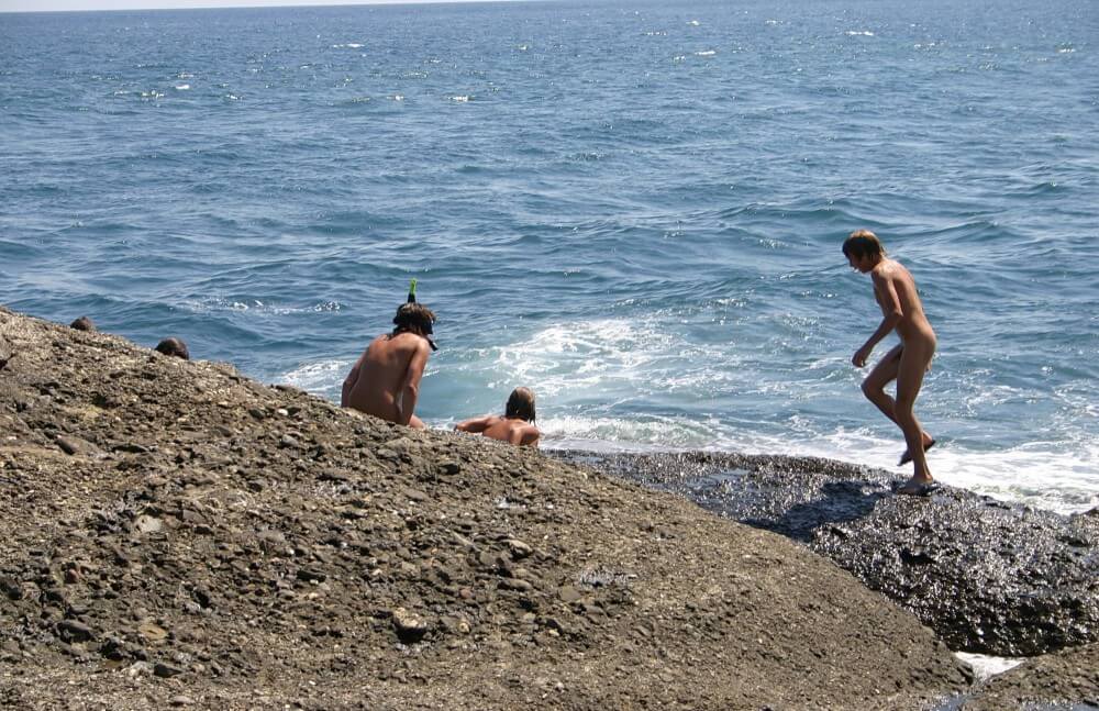 Leaning Against Hit Rocks pics - Nudism has been around for a very long time